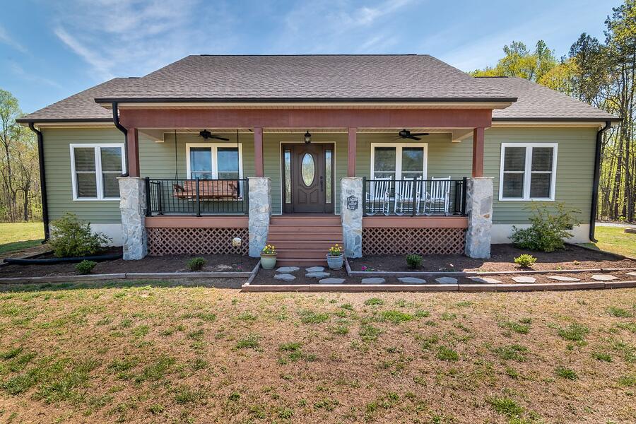 A Craftsman bungalow in East Sacramento with a deep front porch and tapered columns